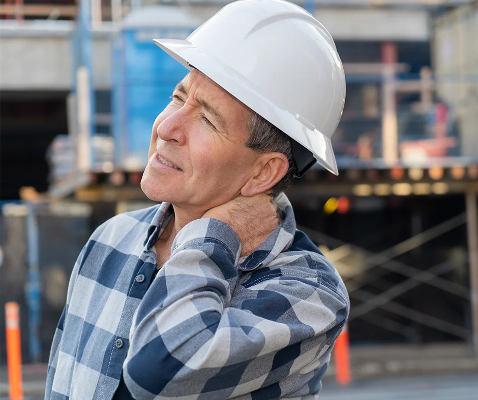 Construction worker suffering from neck pain